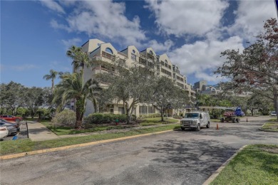 Perched on the top floor of Crystal Bay, this fourth-story condo on Feather Sound Country Club in Florida - for sale on GolfHomes.com, golf home, golf lot