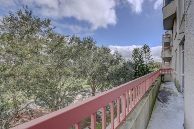 Perched on the top floor of Crystal Bay, this fourth-story condo on Feather Sound Country Club in Florida - for sale on GolfHomes.com, golf home, golf lot