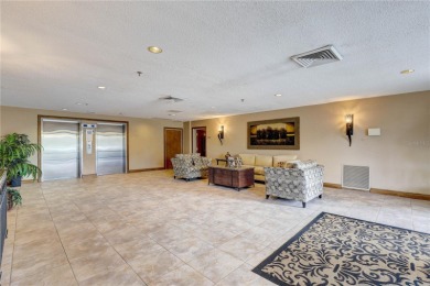 Perched on the top floor of Crystal Bay, this fourth-story condo on Feather Sound Country Club in Florida - for sale on GolfHomes.com, golf home, golf lot