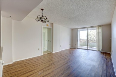 Perched on the top floor of Crystal Bay, this fourth-story condo on Feather Sound Country Club in Florida - for sale on GolfHomes.com, golf home, golf lot
