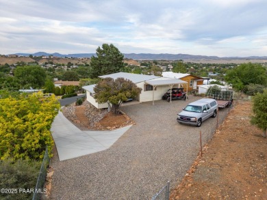 Wonderful mountain & sunset views await in this great property! on Prescott Golf and Country Club in Arizona - for sale on GolfHomes.com, golf home, golf lot