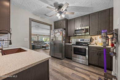 Welcome to 162 Quarterdeck Townes, a single-story townhome with on River Bend Golf and Country Club in North Carolina - for sale on GolfHomes.com, golf home, golf lot