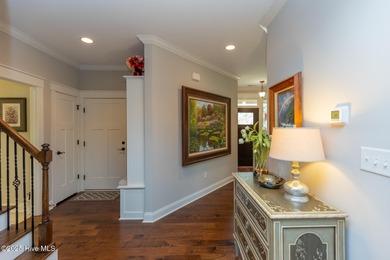 Situated along the fairways of the Woods Golf Course in on Whispering Woods in North Carolina - for sale on GolfHomes.com, golf home, golf lot