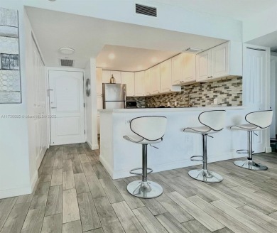 This stunning & totally remodeled corner unit with panoramic on Turnberry Isle Resort and Club in Florida - for sale on GolfHomes.com, golf home, golf lot