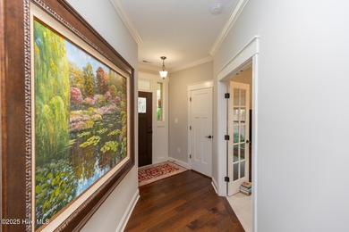 Situated along the fairways of the Woods Golf Course in on Whispering Woods in North Carolina - for sale on GolfHomes.com, golf home, golf lot