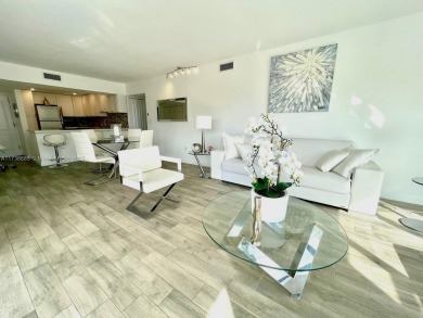 This stunning & totally remodeled corner unit with panoramic on Turnberry Isle Resort and Club in Florida - for sale on GolfHomes.com, golf home, golf lot