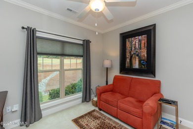 Situated along the fairways of the Woods Golf Course in on Whispering Woods in North Carolina - for sale on GolfHomes.com, golf home, golf lot