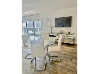This stunning & totally remodeled corner unit with panoramic on Turnberry Isle Resort and Club in Florida - for sale on GolfHomes.com, golf home, golf lot