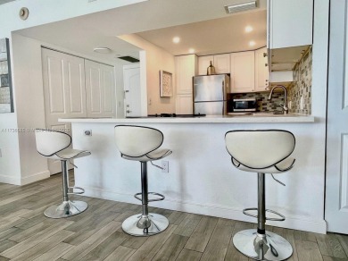 This stunning & totally remodeled corner unit with panoramic on Turnberry Isle Resort and Club in Florida - for sale on GolfHomes.com, golf home, golf lot