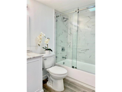 This stunning & totally remodeled corner unit with panoramic on Turnberry Isle Resort and Club in Florida - for sale on GolfHomes.com, golf home, golf lot