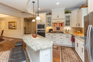 Situated along the fairways of the Woods Golf Course in on Whispering Woods in North Carolina - for sale on GolfHomes.com, golf home, golf lot