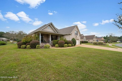 Welcome to your beautiful brick home overlooking a peaceful pond on Cape Fear National At Brunswick Forest in North Carolina - for sale on GolfHomes.com, golf home, golf lot