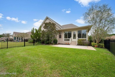 Welcome to your beautiful brick home overlooking a peaceful pond on Cape Fear National At Brunswick Forest in North Carolina - for sale on GolfHomes.com, golf home, golf lot