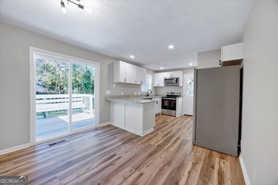 This 4-bedroom, 2-bath home has been completely updated from top on Golf Club of Macon in Georgia - for sale on GolfHomes.com, golf home, golf lot