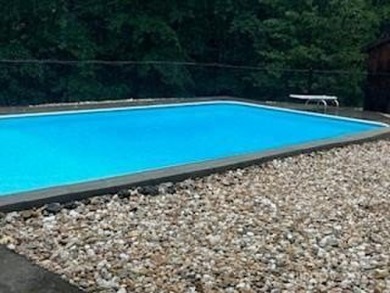 Beautiful mountain feel & custom features! 2.3 acres with a pond on Orchard Hills Golf Course in North Carolina - for sale on GolfHomes.com, golf home, golf lot
