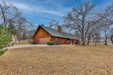 This COZY HUGE STONE FIREPLACE dominates the pleasant living on Lake Kiowa Golf Course in Texas - for sale on GolfHomes.com, golf home, golf lot