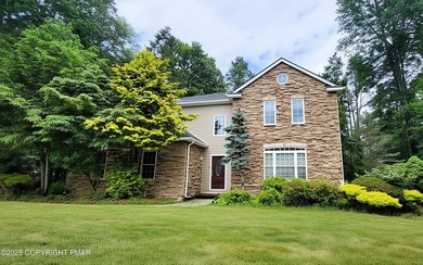 Tucked away on over an acre of wooded privacy, this 5-bedroom on Great Bear Golf and Country Club in Pennsylvania - for sale on GolfHomes.com, golf home, golf lot