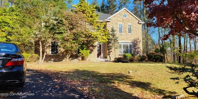 Tucked away on over an acre of wooded privacy, this 5-bedroom on Great Bear Golf and Country Club in Pennsylvania - for sale on GolfHomes.com, golf home, golf lot