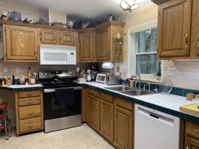 You'll enjoy the quality, 6' walls and workmanship of the lovely on Lost Lake Woods Club in Michigan - for sale on GolfHomes.com, golf home, golf lot