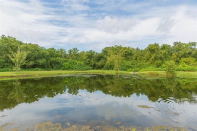 Waterfront POND lot with stunning water views! This 2-bedroom on Caloosa Greens Executive Golf Course in Florida - for sale on GolfHomes.com, golf home, golf lot