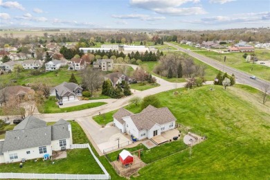 Nestled within an exclusive golf course community, this stunning on Hillcrest Country Club in Iowa - for sale on GolfHomes.com, golf home, golf lot
