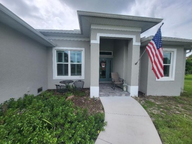 As you enter this 3 bedroom,  2 &1/2 bath, 3 car garage, canal on Rotonda Golf and Country Club - Long Marsh  in Florida - for sale on GolfHomes.com, golf home, golf lot
