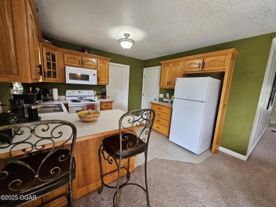 Charming 3-Bedroom, 2-Bath in Desirable Cedar Ridge - Carl on Twin Hills Golf and Country Club in Missouri - for sale on GolfHomes.com, golf home, golf lot