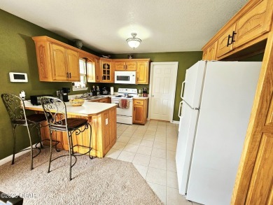 Charming 3-Bedroom, 2-Bath in Desirable Cedar Ridge - Carl on Twin Hills Golf and Country Club in Missouri - for sale on GolfHomes.com, golf home, golf lot