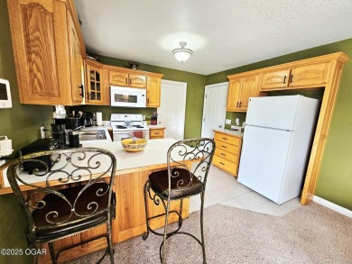 Charming 3-Bedroom, 2-Bath in Desirable Cedar Ridge - Carl on Twin Hills Golf and Country Club in Missouri - for sale on GolfHomes.com, golf home, golf lot