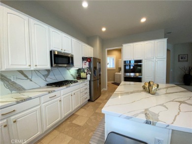 Welcome to this beautifully upgraded Emerald model home, located on Oak Valley Golf Club in California - for sale on GolfHomes.com, golf home, golf lot