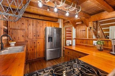 Welcome to Bear's Den, a beautiful Hearthstone LOG CABIN located on Alpine Lake Resort in West Virginia - for sale on GolfHomes.com, golf home, golf lot