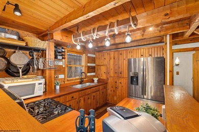 Welcome to Bear's Den, a beautiful Hearthstone LOG CABIN located on Alpine Lake Resort in West Virginia - for sale on GolfHomes.com, golf home, golf lot