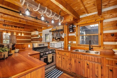 Welcome to Bear's Den, a beautiful Hearthstone LOG CABIN located on Alpine Lake Resort in West Virginia - for sale on GolfHomes.com, golf home, golf lot