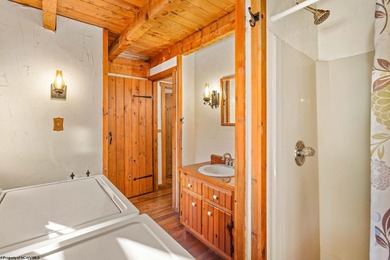 Welcome to Bear's Den, a beautiful Hearthstone LOG CABIN located on Alpine Lake Resort in West Virginia - for sale on GolfHomes.com, golf home, golf lot