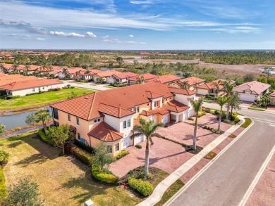 This stunning, rarely available, first level end-unit Bella Casa on Sarasota National Golf Club in Florida - for sale on GolfHomes.com, golf home, golf lot