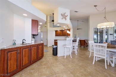 Spacious 3 bedroom 2 bath pool home in CAPE ROYAL, a gated golf on Royal Tee Country Club in Florida - for sale on GolfHomes.com, golf home, golf lot