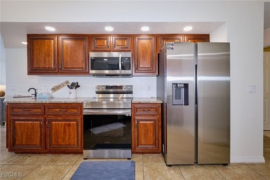 Spacious 3 bedroom 2 bath pool home in CAPE ROYAL, a gated golf on Royal Tee Country Club in Florida - for sale on GolfHomes.com, golf home, golf lot