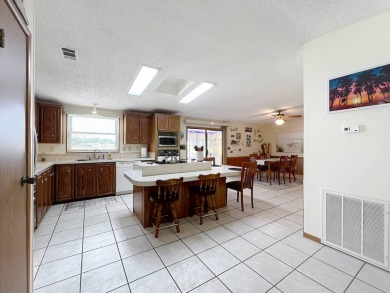 Amazing & Well-Maintained Palm Harbor Home - Premium Waterfront on Plantation Golf Club in Florida - for sale on GolfHomes.com, golf home, golf lot