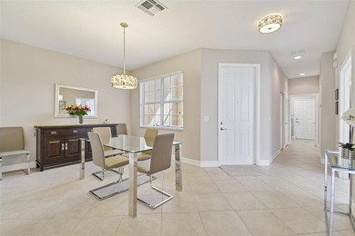 An opportunity to own a Nantucket model villa with a water view on Caloosa Greens Executive Golf Course in Florida - for sale on GolfHomes.com, golf home, golf lot