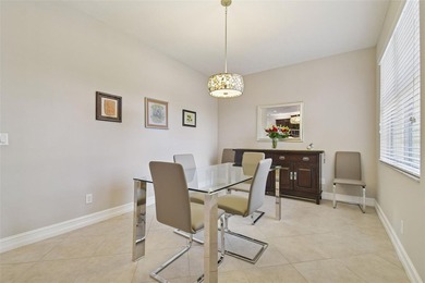 An opportunity to own a Nantucket model villa with a water view on Caloosa Greens Executive Golf Course in Florida - for sale on GolfHomes.com, golf home, golf lot