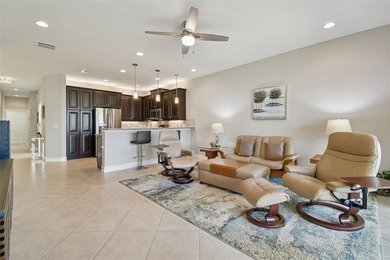 An opportunity to own a Nantucket model villa with a water view on Caloosa Greens Executive Golf Course in Florida - for sale on GolfHomes.com, golf home, golf lot