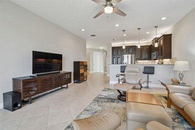 An opportunity to own a Nantucket model villa with a water view on Caloosa Greens Executive Golf Course in Florida - for sale on GolfHomes.com, golf home, golf lot