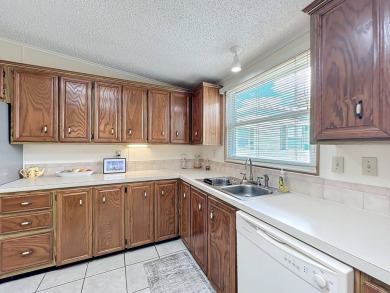 Amazing & Well-Maintained Palm Harbor Home - Premium Waterfront on Plantation Golf Club in Florida - for sale on GolfHomes.com, golf home, golf lot