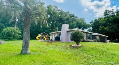 Welcome to this home in Citrus Springs, FL situated on over 1/2 on Citrus Springs Country Club in Florida - for sale on GolfHomes.com, golf home, golf lot