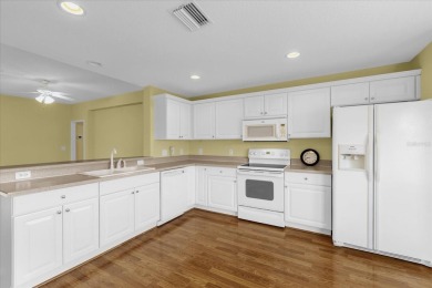 Welcome to this beautifully maintained Challedon model home in on Eagle Ridge At Spruce Creek Country Club in Florida - for sale on GolfHomes.com, golf home, golf lot