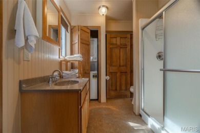 Private setting on lake Silveratta,  newer style custom chalet on Innsbrook Resort Golf Course in Missouri - for sale on GolfHomes.com, golf home, golf lot