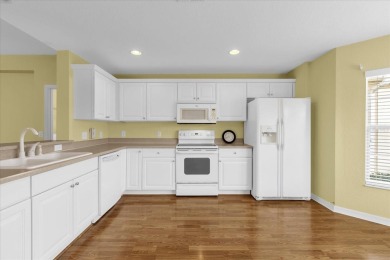 Welcome to this beautifully maintained Challedon model home in on Eagle Ridge At Spruce Creek Country Club in Florida - for sale on GolfHomes.com, golf home, golf lot