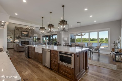A STORYBOOK HOME ON TELLICO LAKE. 

Tucked into the scenic on Tellico Village -The Links At Kahite Golf Course in Tennessee - for sale on GolfHomes.com, golf home, golf lot