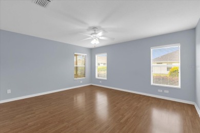 Welcome to this beautifully maintained Challedon model home in on Eagle Ridge At Spruce Creek Country Club in Florida - for sale on GolfHomes.com, golf home, golf lot