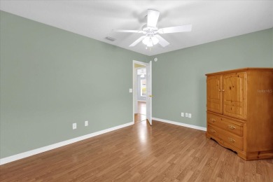 Welcome to this beautifully maintained Challedon model home in on Eagle Ridge At Spruce Creek Country Club in Florida - for sale on GolfHomes.com, golf home, golf lot
